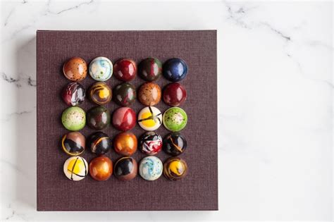 Premium Photo Assortment Of Painted Handcrafted Chocolate Bonbons