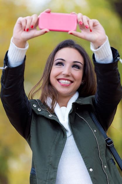 Free Photo Beautiful Girl Taking A Selfie In Autumn