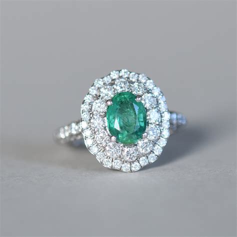 Exceptional 18ct White Gold Emerald And Diamond Double Halo Ring