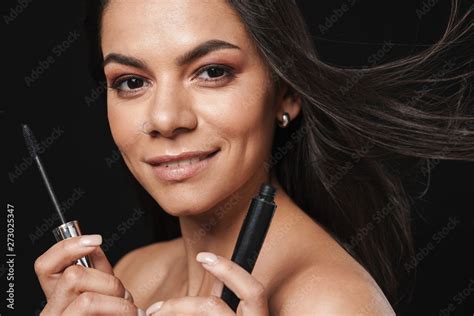 Beautiful Naked Woman Posing Isolated Over Black Wall Background