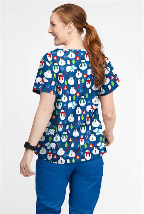 Ua Butter Soft North Pole Party Royal Women S 4 Pocket Notch Neck Print Scrub Top Print Scrubs