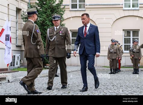 Polish And Korean National Flags Wave As Mariusz B Aszczak Minister Of