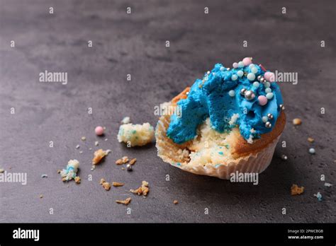 Failed Cupcake With Cream On Grey Table Troubles Happen Stock Photo