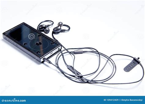 High Quality Music Player With Headphones Close Up On An Isolated Light