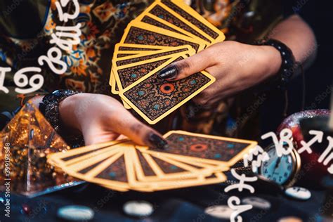 Astrology And Divination A Fortune Teller Holds A Fan Of Tarot Cards