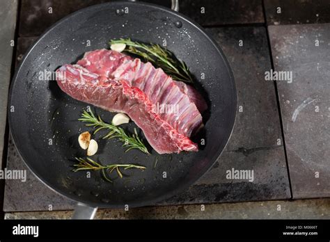 Fried Ribs Of Lamb Add A Sprig Of Rosemary And Garlic Cooking With Fire In Frying Pan