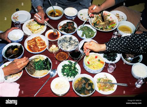 Family eating variety typical Korean food at home Stock Photo - Alamy