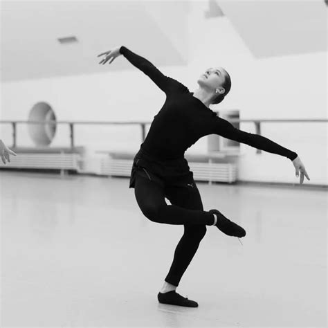 Two Dancers In Black And White Pose For The Camera