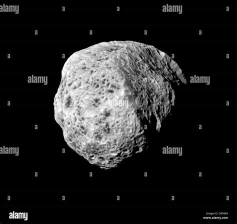 The sponge-like surface of Saturn's moon Hyperion is highlighted in ...