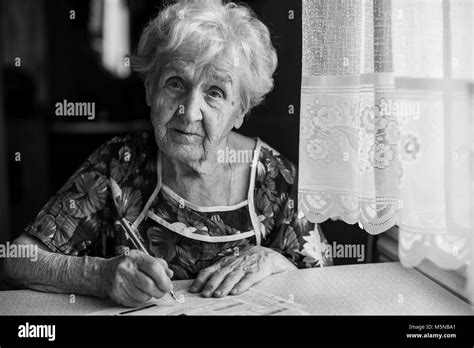 Sad Mature Woman Utility Bills Black And White Stock Photos Images