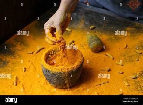 Woman Hand Powdering Indian Spices Turmeric Powder Splash Explosion