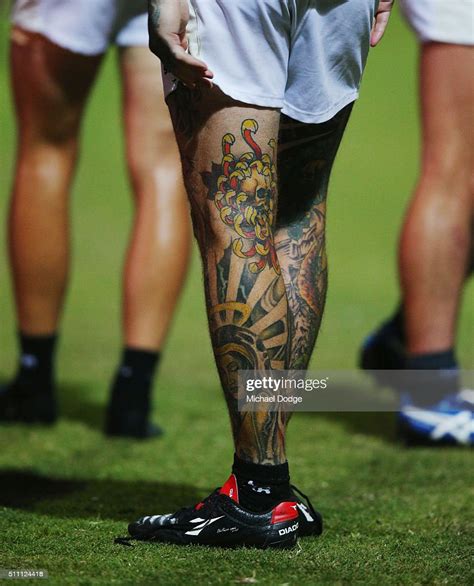 The Tattooed Legs Of Dane Swan Of The Magpies Are Seen During The