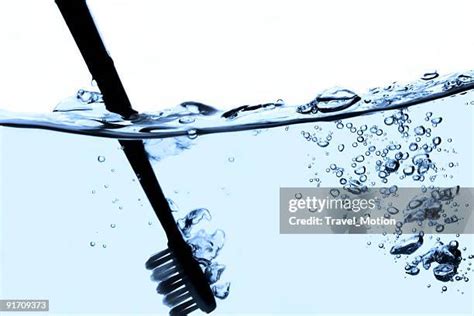 Water Toothbrush Photos and Premium High Res Pictures - Getty Images