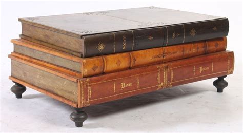 Lot 127 LEATHER COFFEE TABLE FORM 3 STACKED BOOKS Lot Number 127