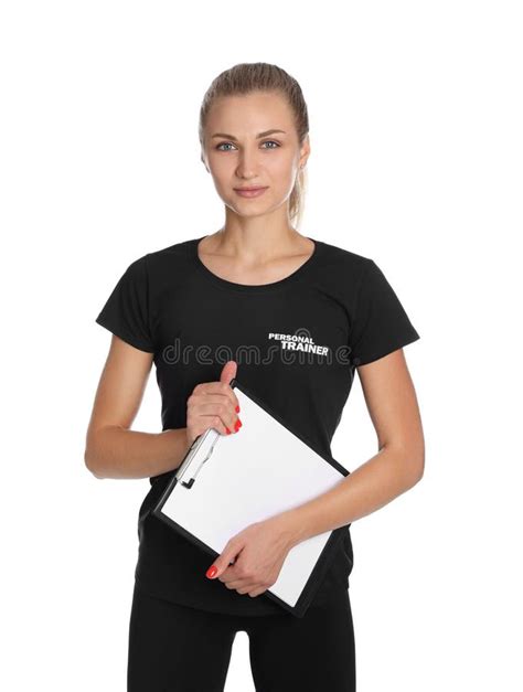 Portrait Of Personal Trainer With Clipboard On White Background Gym