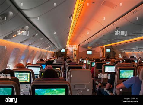 Boeing 777-300 passenger compartment economy class during flight Dubai ...