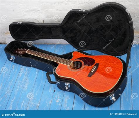 Musical Instrument - Orange Acoustic Guitar in Hard Case Stock Image - Image of octave, modern ...