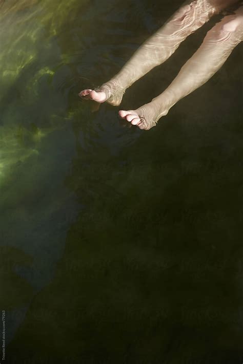 Woman S Legs Floating On Water At Hot Springs By Stocksy Contributor Trinette Reed Stocksy