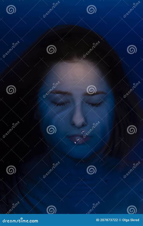 Portrait Of Attractive Brunette Woman Topless In Blue Liquid In
