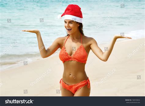 Sexy Woman Wearing Bikini Christmas Hat Stock Photo