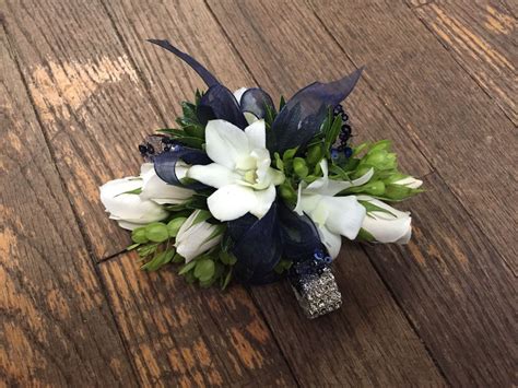 Navy Blue And White Prom Corsage With Roses And Dendrobium Orchids