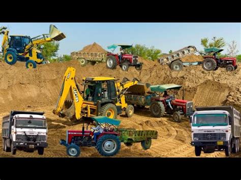 Jcb Dx Backhoe Loading Mud In Mahindra Di Tractor Jcb Dx Xtra