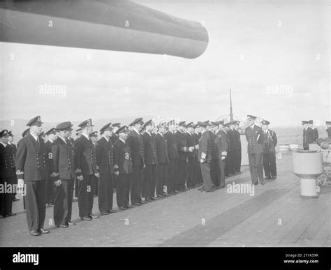 HMS Howe. August 1942. The commissioned officers of HMS HOWE being introduced to the C-in-C by ...