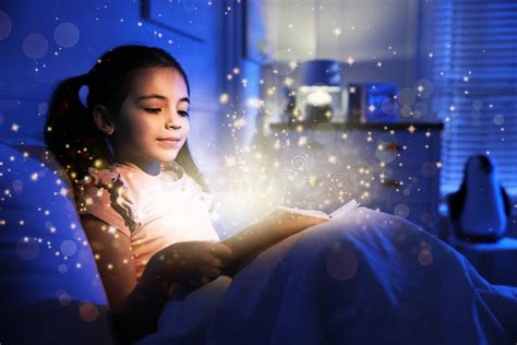 Little Girl Reading Fairy Tale in Dark Bedroom Stock Photo - Image of indoors, light: 217946700