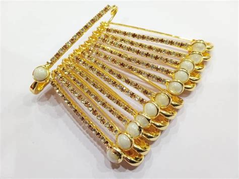 Saree Pins Gold Covering With White And Golden Stones Size Of 5 0 Cm