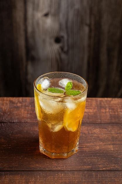 Premium Photo Glass Of Iced Tea With Lemon And Mint