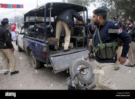 Police Officials Inspecting Destroyed Police Van After A Bomb Blast