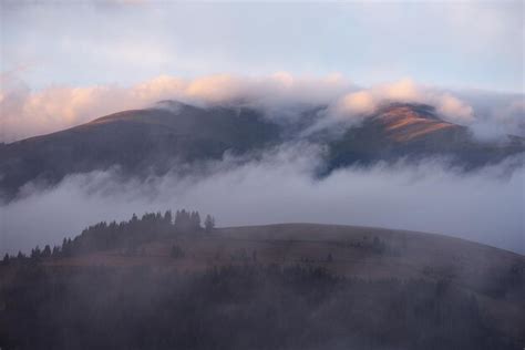 Premium Photo | Beautiful sunrise clouds over the mountains autumn ...