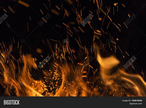 Fire flames on a black background. Blaze fire flame texture background ...