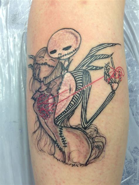 A Tattoo On The Leg Of A Person With A Skeleton Holding A Heart And Arrow