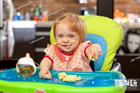 Adorable Red Haired Baby Girl Eating Corn Crisps Stock Photo Picture