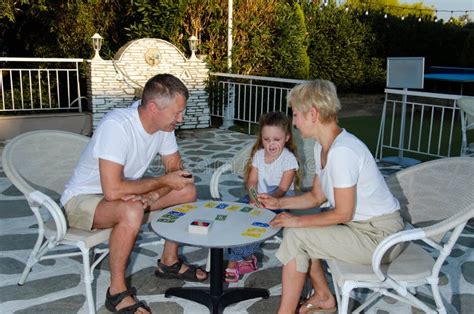 Family with One Child Playing Uno. Stock Photo - Image of sithonia, playtime: 300601820