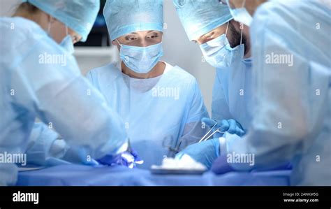 Serious Surgeon Team Performing Cardiothoracic Surgery Hospital