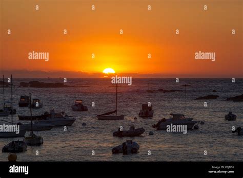 Sunset On The Harbour Of Tregastel With Between Perros Guirec And