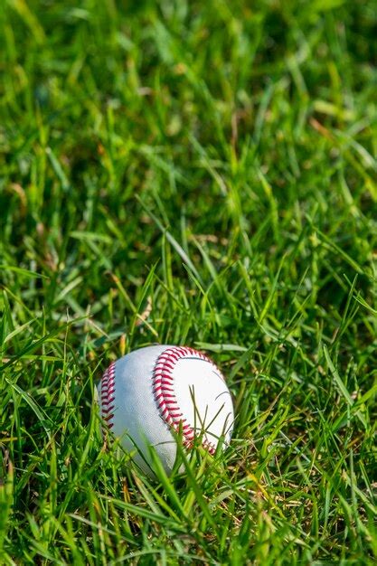 Premium Photo Close Up Of Baseball On Grassy Field