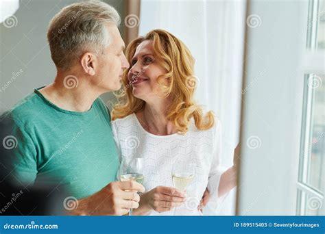 Portrait Of Loving Mature Couple By Window Stock Image Image Of