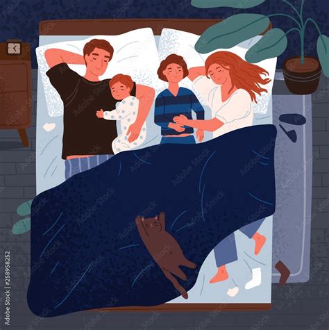 Mother, father and children sleeping together on one bed. Mom, dad and ...