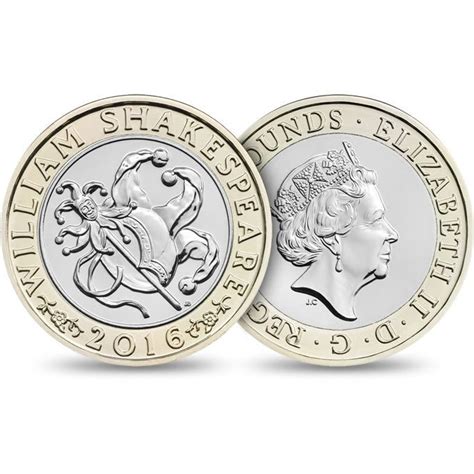 two pound coin with an image of a plane on the front and back, both in gold and silver