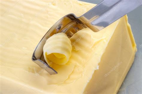 Using butter curler Stock Photo by ©arskajuhani 88095208