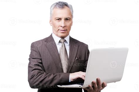 Always Busy Handsome Mature Man In Formalwear Adjusting Holding Laptop