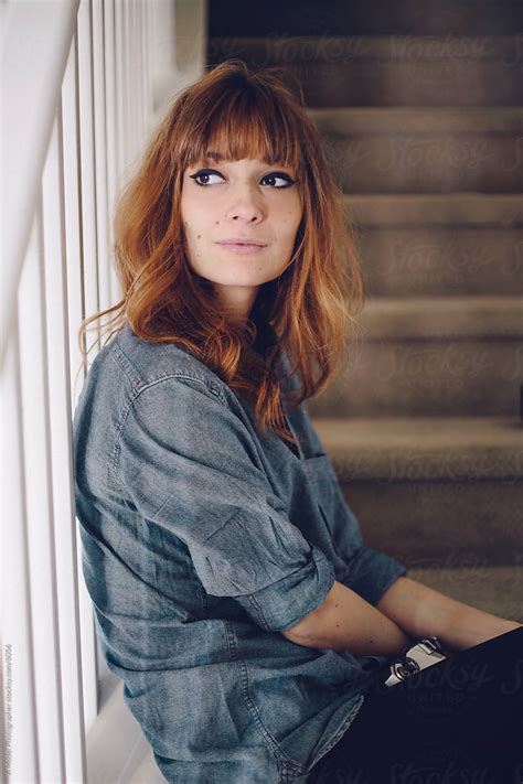 Young Woman Sitting On The Stairs By Stocksy Contributor A Model