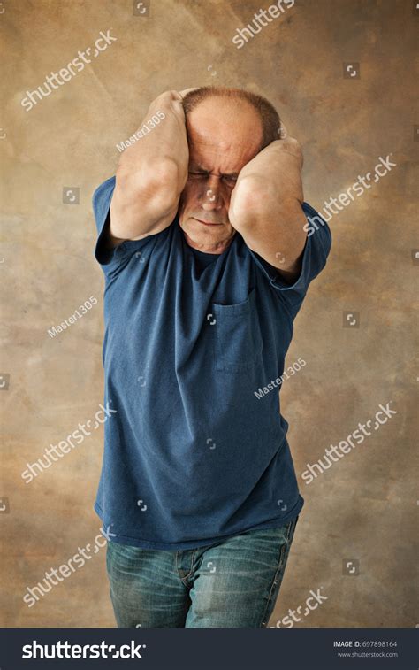 Worried Mature Man Touching His Head Stock Photo 697898164 Shutterstock