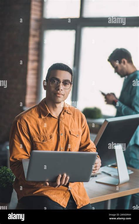 Intelligent Handsome Man Having His Laptop In Hands Stock Photo Alamy