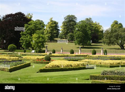 Gardens With Low Hedges And Distant Trees Stock Photo Alamy