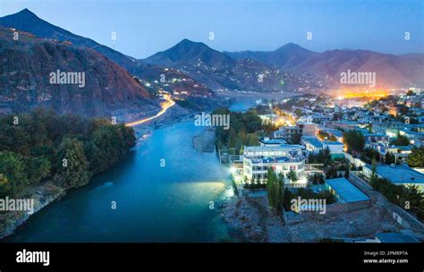 A Long Shutter Photo Of Fayzabad City With A View Of Kokcha River In A