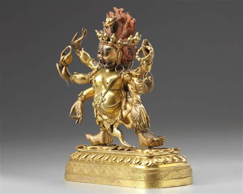 A Tibetan Gilt Bronze Six Armed Mahakala